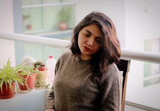 beautiful-woman-sitting-table-home